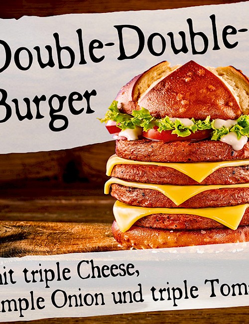 Double-Double-Burger mit triple Cheese, simple Onion und triple Tomate
